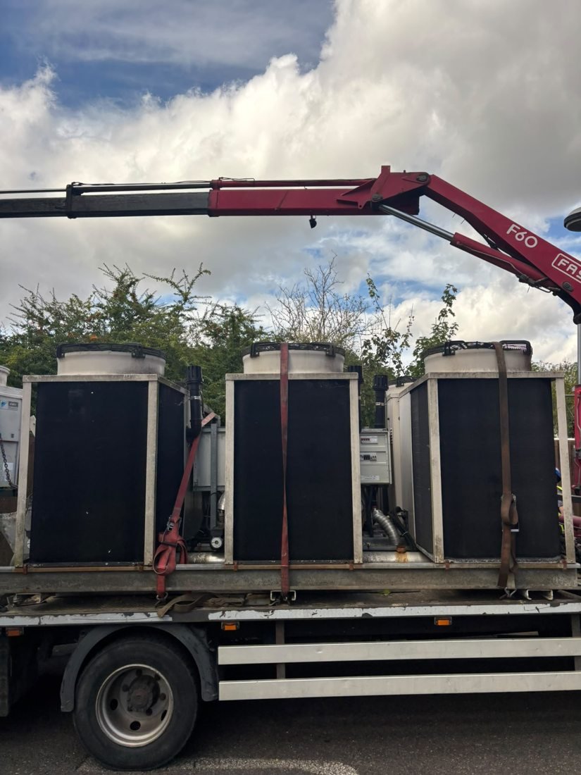 Large industrial units secured on a flatbed truck