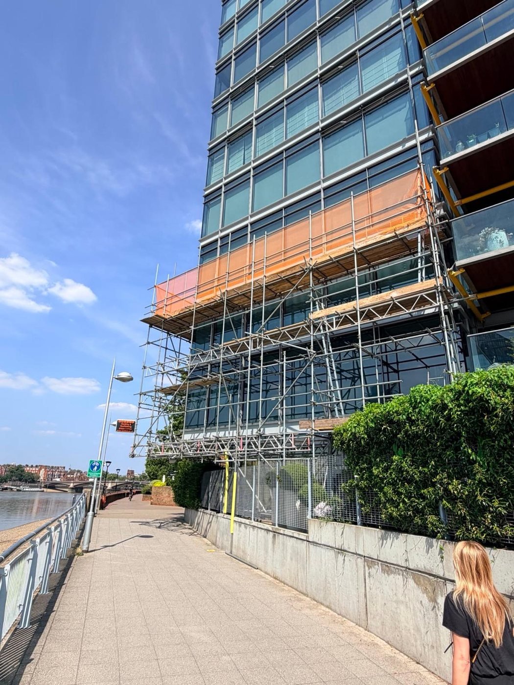 Scaffolding: glass-fronted building - walkway view