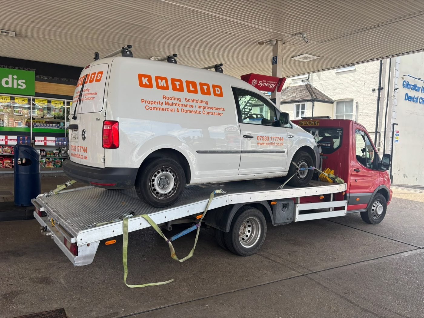 White van secured on a JMA recovery truck